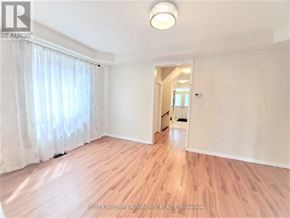 Mississauga (Churchill Meadows) apartment for rent - A room with wooden flooring and a white ceiling with a light fixture.