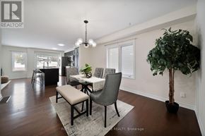 Cambridge apartment for rent - A dining room with a table set for two and a potted plant.