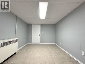 Windsor apartment for rent - A room with a white door and a radiator on the left side.