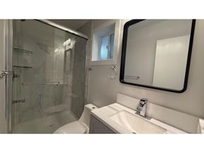 Langley apartment for rent - A white sink is mounted under a mirror in a bathroom.