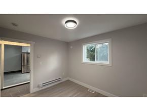 Langley apartment for rent - A room with a window, a radiator, and a marble floor.