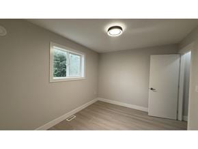 Langley apartment for rent - A room with a window and a door.