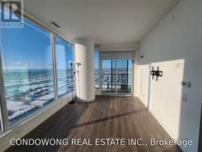Vaughan (Vaughan Corporate Centre) condo for rent - A room with a view of the cityscape from a large window.