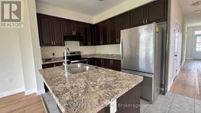 Niagara Falls (Brown) apartment for rent - A wooden staircase with a bamboo railing.