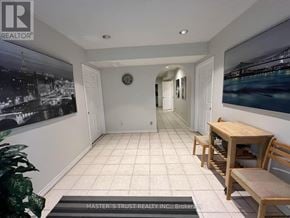 Toronto (Hillcrest Village) apartment for rent - A hallway with a clock on the wall and a bench on the right side.