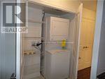 Toronto (Henry Farm) condo for rent - A white refrigerator is in a kitchen next to a white door.
