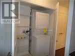 Toronto (Henry Farm) condo for rent - A white refrigerator is in a kitchen next to a white door.