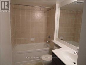 Toronto (Henry Farm) condo for rent - A bathroom with a tub, toilet, and sink.