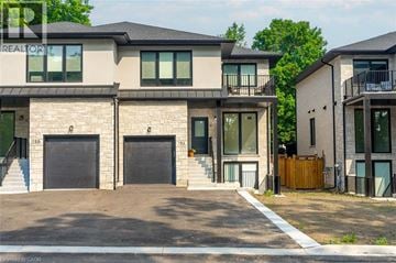 Rockwood apartment for rent - A modern two-story house with a garage is shown in the image.