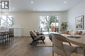 Rockwood apartment for rent - A modern living room with a dining table and chairs.