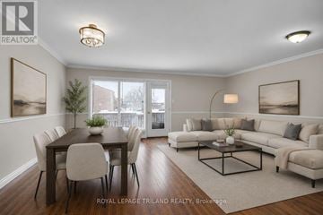 London South (South N) townhouse for rent - A well-lit living room with a dining table and a couch.