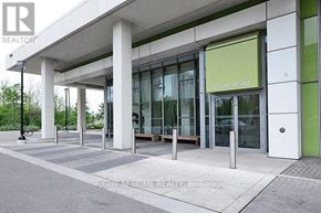 Mississauga (City Centre) condo for rent - A building with a glass door and a sign that says "SCHOOL OF THE DRIVE".