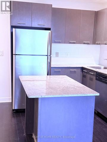 Mississauga (City Centre) condo for rent - A kitchen with a refrigerator and a counter.