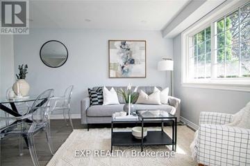 Oakville (Wo West) apartment for rent - A living room with a glass table and a sofa.