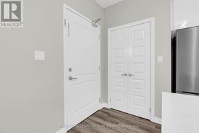 Milton (Wi Willmott) condo for rent - A white door is on the left and a white door with a panel design is on the right.