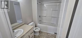 Kingston (City Northwest) townhouse for rent - A bathroom with a toilet, sink, and shower.