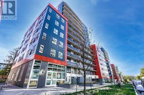 Waterloo condo for rent - A modern multi-story building with a red and blue facade.