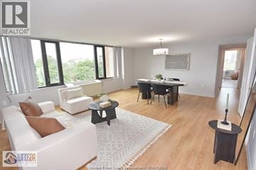 Windsor condo for rent - A living room with a white sofa and a black coffee table.