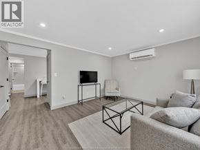 Windsor apartment for rent - A living room with a grey couch and a black metal coffee table.