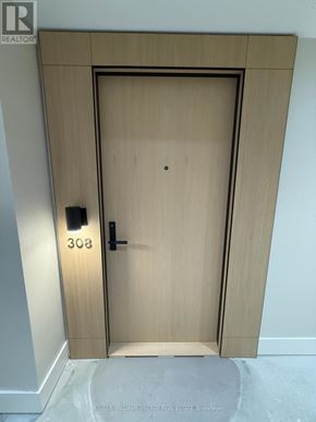 Toronto (Englemount-Lawrence) condo for rent - A wooden door with the number 308 on it.