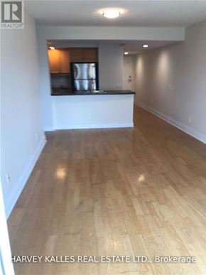 Toronto (Willowdale East) condo for rent - A room with wooden flooring and a bar area.