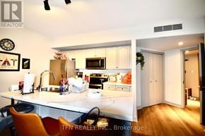 Oro-Medonte (Horseshoe Valley) condo for rent - A kitchen with a sink, stove, and refrigerator.