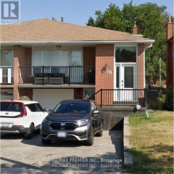 Toronto (Humber Summit) apartment for rent - A house with a car parked in front of it.