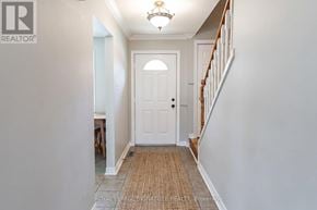 Mississauga (Streetsville) townhouse for rent - A hallway with a white door and a brown carpet.