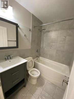 Mississauga (Cooksville) condo for rent - A bathroom with a toilet, sink, and bathtub.