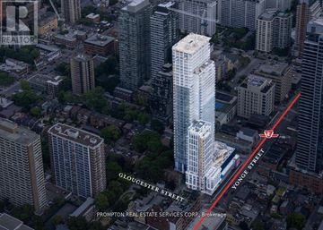 Toronto (Church-Yonge Corridor) condo for rent - An aerial view of a city with a tall building in the foreground and a red line indicating a street.
