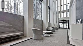 Toronto (Church-Yonge Corridor) condo for rent - A reception area with a grey carpet and a white reception desk.