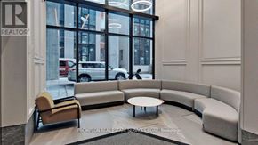 Toronto (Church-Yonge Corridor) condo for rent - A realtor's office with a large window and a view of the street.