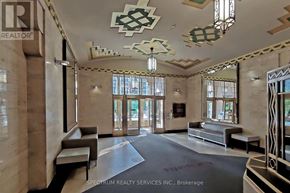 Toronto (Niagara) condo for rent - A reception area with a marble floor and a ceiling with a geometric pattern.