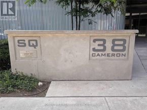 Toronto (Kensington-Chinatown) condo for rent - A concrete structure with the letters "SQ" and the number "38 Cameron" on it.