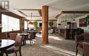 Smiths Falls condo for rent - A room with a pool table and a bar area.
