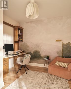 Smiths Falls condo for rent - A room with a desk, chair, and a couch.