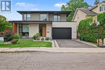 Ottawa apartment for rent - A modern house with a garage is for sale.