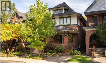 Hamilton apartment for rent - A house with a tree in front of it.