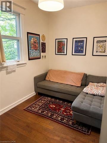 Hamilton apartment for rent - A living room with a grey couch and a rug.