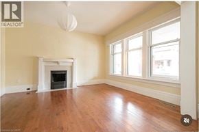 Hamilton apartment for rent - A room with a fireplace and a window.