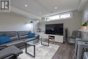Richmond Hill (Crosby) apartment for rent - A living room with a grey sofa and a glass coffee table.