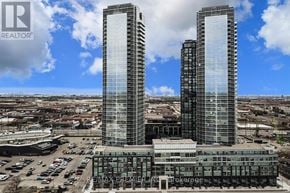 Vaughan (Concord) condo for rent - Two tall buildings with the words REALTOR and REMAX PREMIER on them.