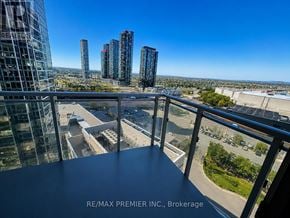 Vaughan (Concord) condo for rent - A view from a balcony overlooking a cityscape with skyscrapers.