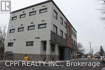 Port Colborne (Main Street) townhouse for rent - A building with the text "CPPI REALTY INC., Brokerage" in front of it.