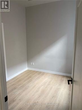Peterborough (Town Ward 3) condo for rent - A room with light wood flooring and white walls.