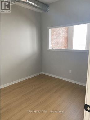 Peterborough (Town Ward 3) condo for rent - A room with a window and a wooden floor.