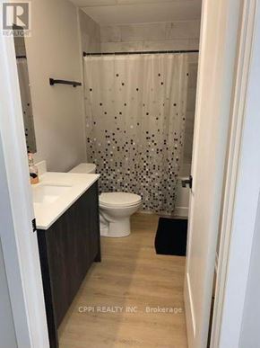 Peterborough (Town Ward 3) condo for rent - A small bathroom with a toilet, sink, and shower.