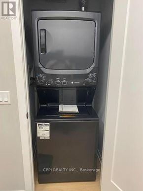 Peterborough (Town Ward 3) condo for rent - A microwave oven is sitting in a cabinet with a sticker that says CPI Realty Inc. Brokerage.