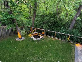 Markham (Thornlea) apartment for rent - A backyard with a fire pit and a fence.