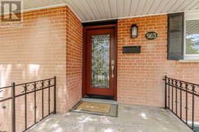 Oakville (Wo West) apartment for rent - A brick house with a brown door and a mailbox on the wall.